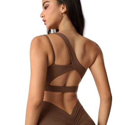 Easelyn Asymmetric One-Shoulder Sports Bra in brown, back view