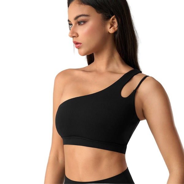 Easelyn Asymmetric One-Shoulder Sports Bra in black, three-quarter view