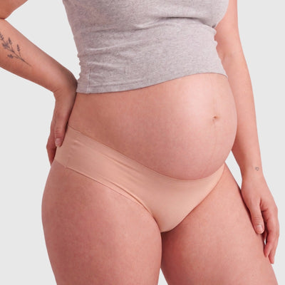 Easelyn Seamless Maternity Briefs — 5 Pack in nude, side view under the bump