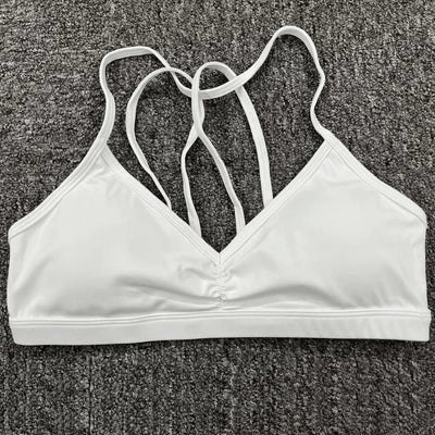 Easelyn Strappy-Back Wireless Bralette in white, flat lay showing the strappy back