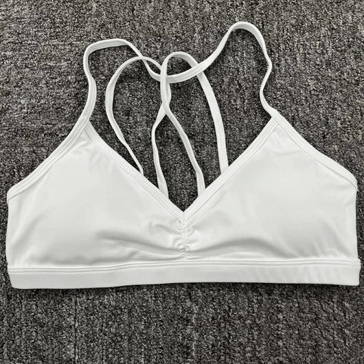 Easelyn Strappy-Back Wireless Bralette in white, flat lay showing the strappy back