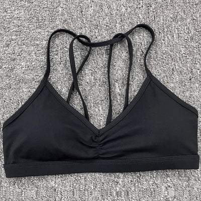 Easelyn Strappy-Back Wireless Bralette in black, flat lay