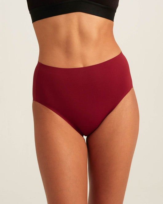 Easelyn Leakproof Seamless High-Waist Period Brief in crimson rose, front view on model
