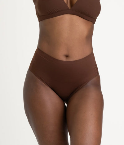 Easelyn Leakproof Seamless High-Waist Period Brief in rich earth, front view on model