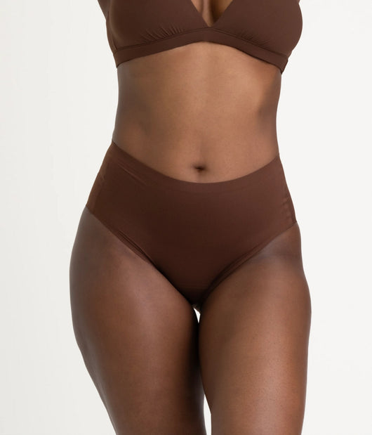 Easelyn Leakproof Seamless High-Waist Period Brief in rich earth, front view on model