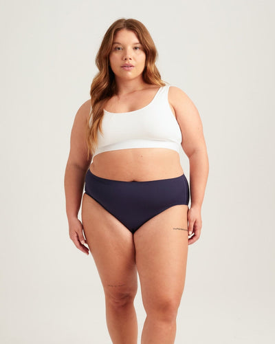 Easelyn Leakproof Seamless High-Waist Period Brief in midnight sky, head-to-knee front view on a curvy model