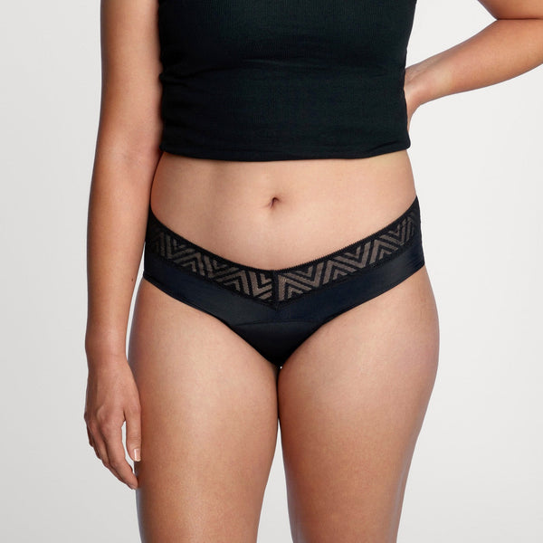 Easelyn Soft-Stretch Period Hiphugger in black, front view on model showing the lace chevron waistband