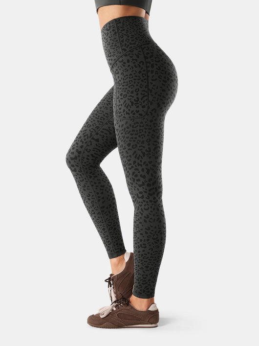 Easelyn Built-In Resistance Band Leggings in Gray Leopard, side view from the waist down showing the high waist and side pocket seam