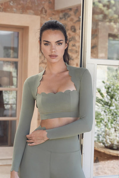 Easelyn Scallop-Edge Long-Sleeve Workout Crop Top in Sage, Mini length, front view showing the scalloped neckline