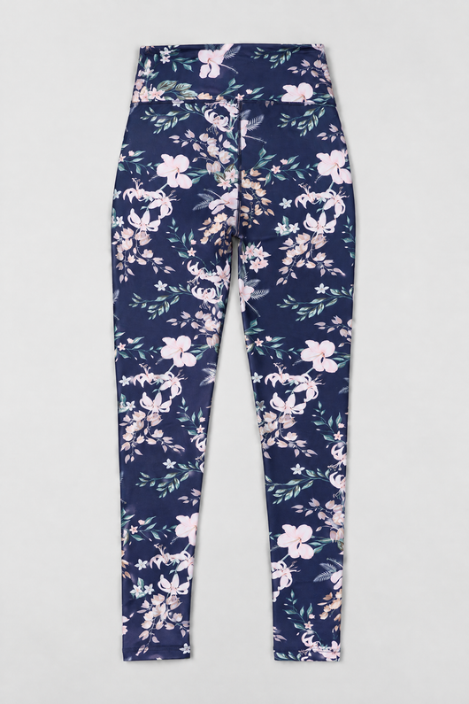 Easelyn UPF 50+ High-Rise Swim Leggings in Tropical Navy Floral, the product laid flat on a plain light-grey surface