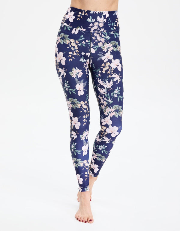 Easelyn UPF 50+ High-Rise Swim Leggings in Tropical Navy Floral, front view on model from the waist down