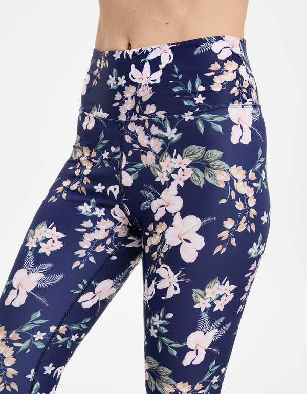 Easelyn UPF 50+ High-Rise Swim Leggings in Tropical Navy Floral, close-up of the high-rise waistband and print