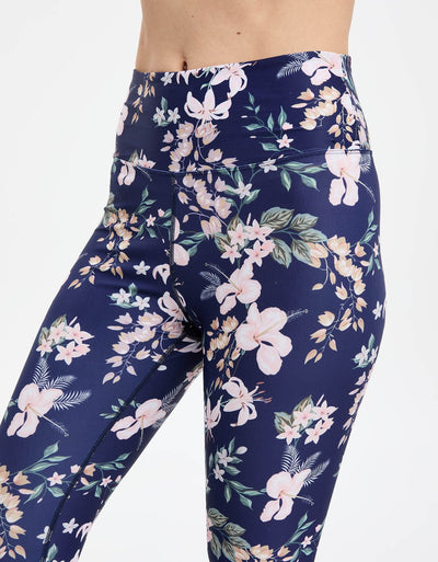 Easelyn UPF 50+ High-Rise Swim Leggings in Tropical Navy Floral, close-up of the high-rise waistband and print