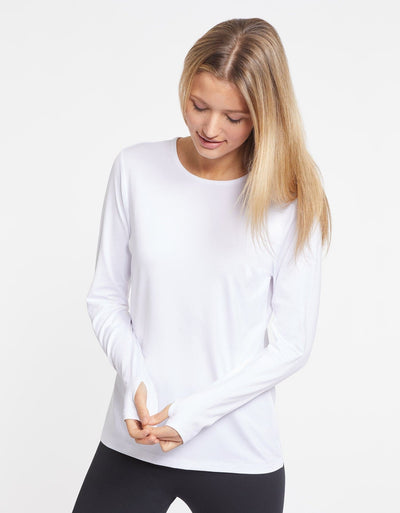 Easelyn UPF 50+ Long-Sleeve Sun Shirt in White, view of both thumbhole cuffs in use