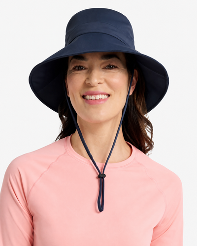 Easelyn UPF 50+ Wide-Brim Sun Hat in Navy, close front view on model with the chin strap fastened