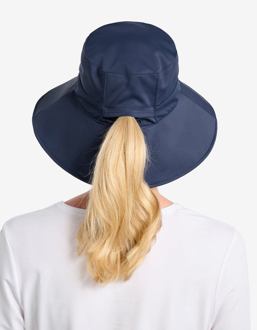 Easelyn UPF 50+ Wide-Brim Sun Hat in Navy, back view with a ponytail pulled through the ponytail opening