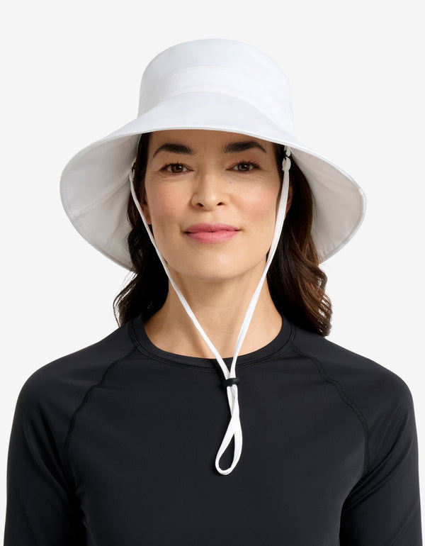 Easelyn UPF 50+ Wide-Brim Sun Hat in White, close front view on model with the chin strap fastened