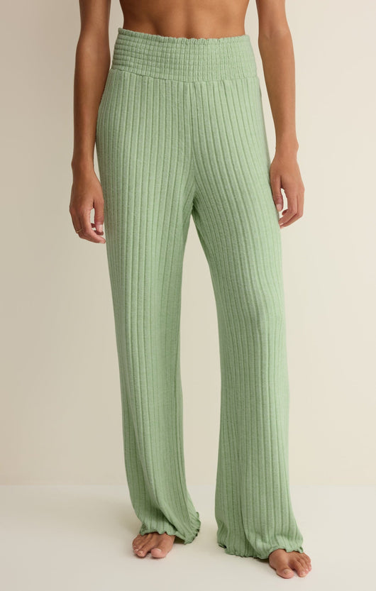 Easelyn Smocked-Waist Rib Flare Lounge Pant in Pistachio, front view from the waist down