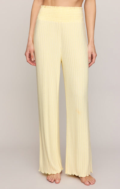 Easelyn Smocked-Waist Rib Flare Lounge Pant in Mellow Yellow, front view from the waist down