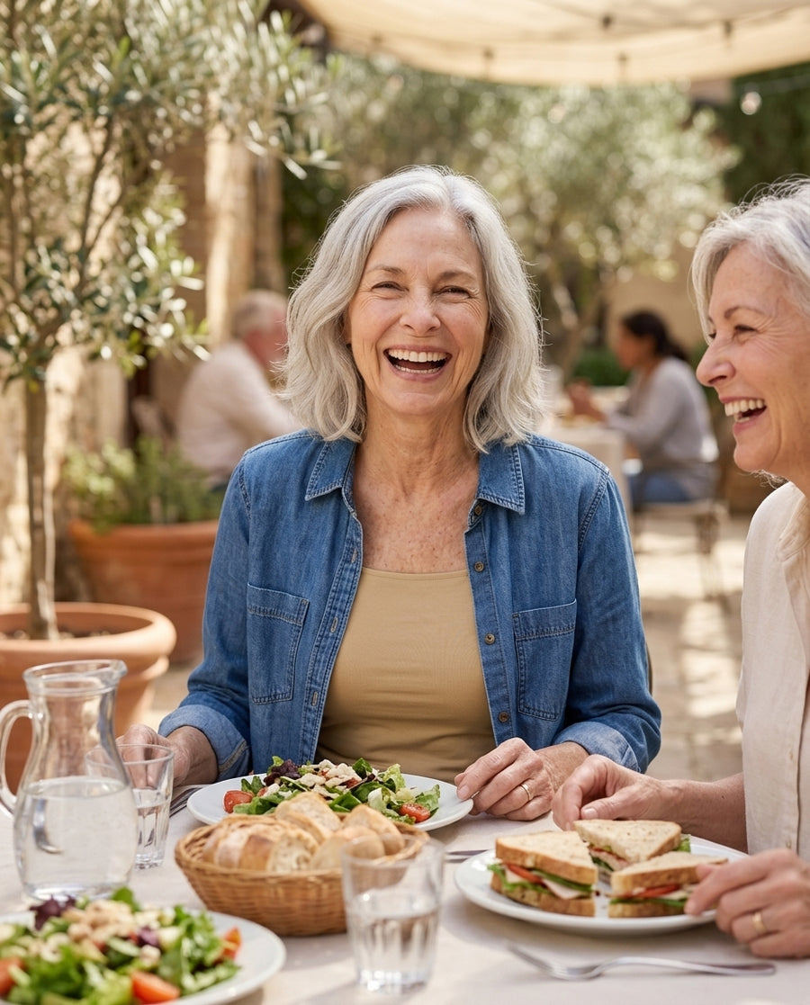 A woman in the EaseHold tank and a cardigan, relaxed at home